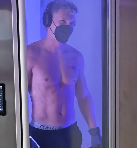 Guest inside the full-body cryotherapy chamber at Beach Wellness Center in Seminole, FL